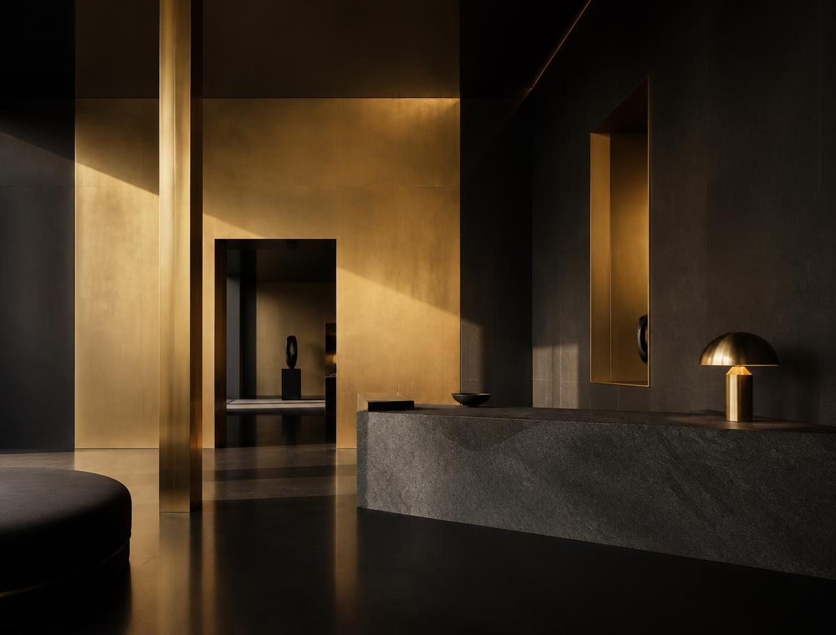 Minimal interior architecture in black and brass